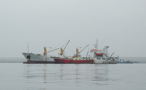 Cargo ship Urgull and the much smaller Maicoa, Paracas Harbor