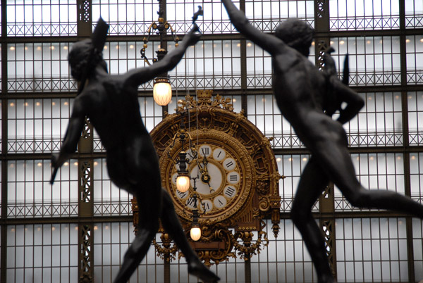 Bronze sculptures with the Gare d'Orsay Station Clock