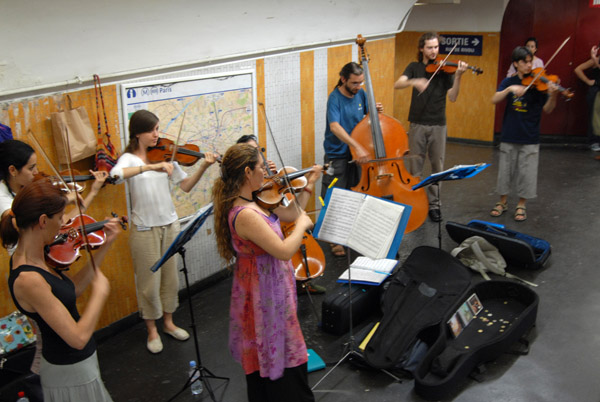 I've seen musicians in the subway before but next a whole orchestra