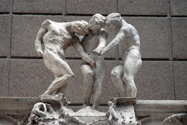 Group of three figures atop Rodin's plaster model of the Gate to Hell
