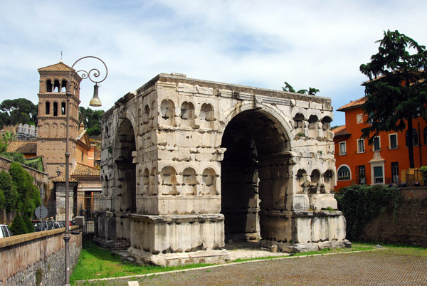 Arch of Janus-4th C. AD, a quadrifrons triumphal arch southwest of the Forum with the 12th C belltower of San Giorgio al Velabro