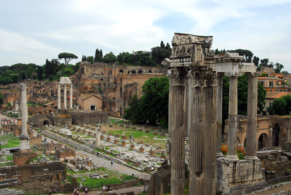 Roman Forum looking at the Palatine Hill with the three columns of the Temple of Vespasian and Titus