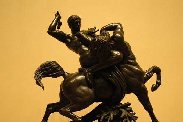 Bronze of a warrior striking a centaur