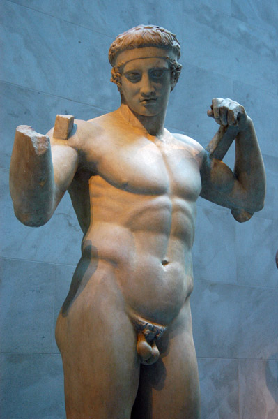 Of this piece, only the head, arms and legs from the knee down are ancient, the rest cast from the copy in Athens