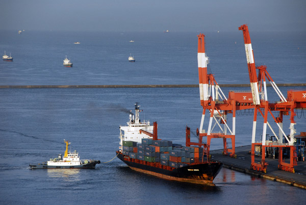 Port of Osaka - Tug boat with the Merkur Bridge