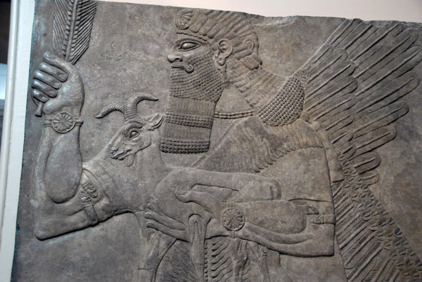 Protective spirit carrying a goat guarded one of the doors to the throne room, Nimrud (northwest palace) Assyrian ca 860 BC
