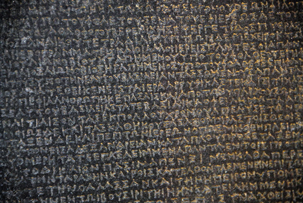 The Rosetta Stone's inscriptions in Greek, Demotic, and Hieroglyphics enabled scholars to decipher the ancient Egyptian writing