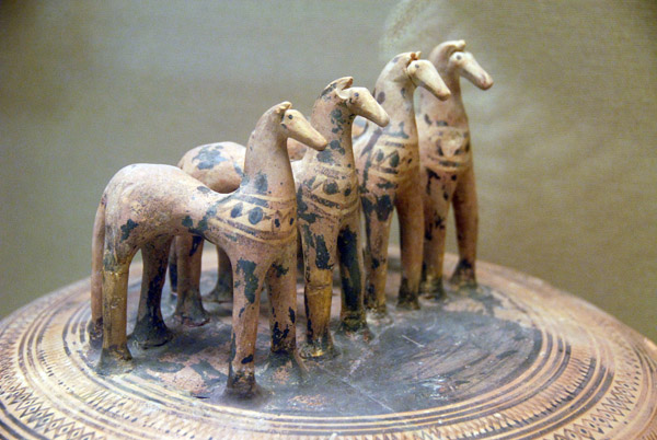 Pyxis (lidded box) with 4 hand-modelled terracotta horses, Athens ca 750 BC