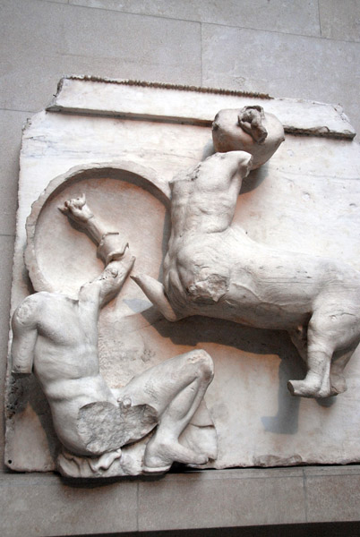 Centaur brings a water-jar down on his opponent, who has left his defence open, Parthenon marbles, South Metope IV