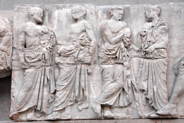 East Frieze IV figures 20-23, men standing between the girls of East Frieze III and the gods of East Frieze IV