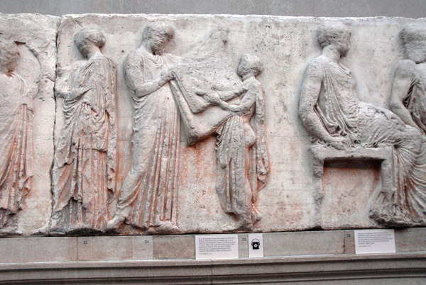 Parthenon East Frieze V - man (fig 34) thought to be the Archon Basilius of Athens taking a Sacred Robe from a child (figure 35)
