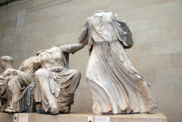 Girl moving rapidly away from the center, representing Hebe, cup-bearer of Zeus who was shown in the middle of the East Pediment