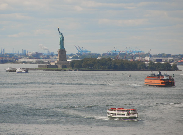Statue of Liberty and New York Harbor with the Staten Island Ferry and Circle Line