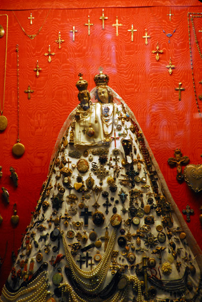 Madonna and Child covered with offerings