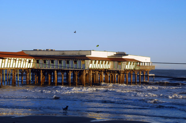 An old pier in Galveston with the Balinese Room Beach Bar