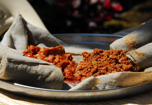Typical Ethiopian meal - spicy meat and injera bread