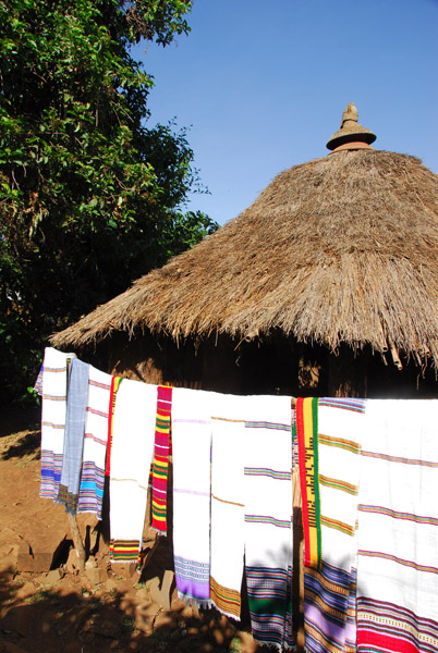 Thatched hut with textile souvenirs