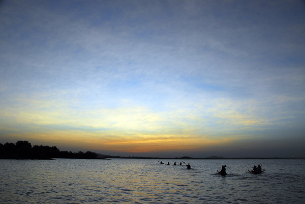 Paddlers at dusk, Lake Tana