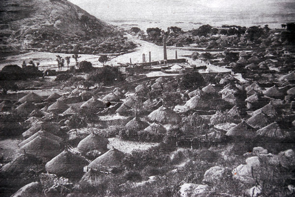 Historic photo of the Stelae field surrounded by huts