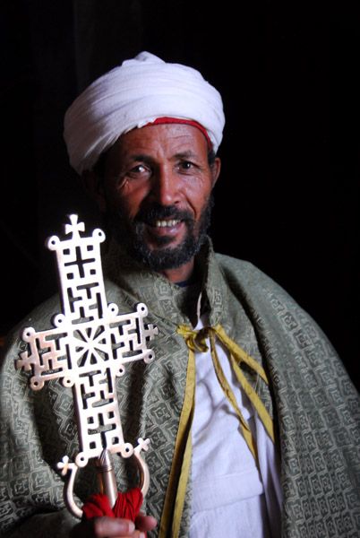 Priest with processional corss of Bet Maryam, Lalibela
