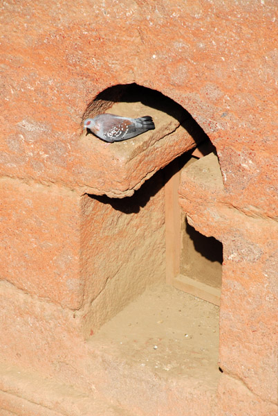 WIndow in the shape of the stele of Axum, perfect for pigeons