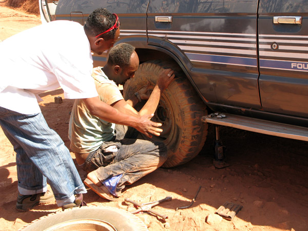 Our driver helping another driver with a tire change