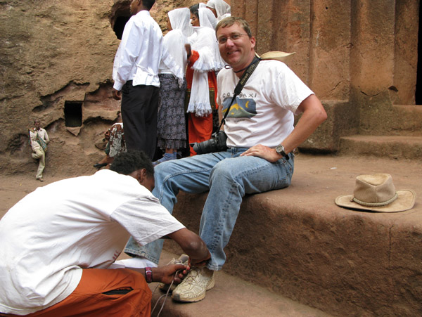 Shoe tender - entry level job at the Churches of Lalibela