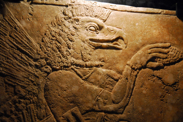 Eagle-headed winged figure worshiping the Sacred Tree, Assyrian from the reign of Ashurnasirpal II (883-859 BC)