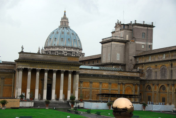 Courtyard of the Vatican Museum with the dome of St. Peters and the sphere