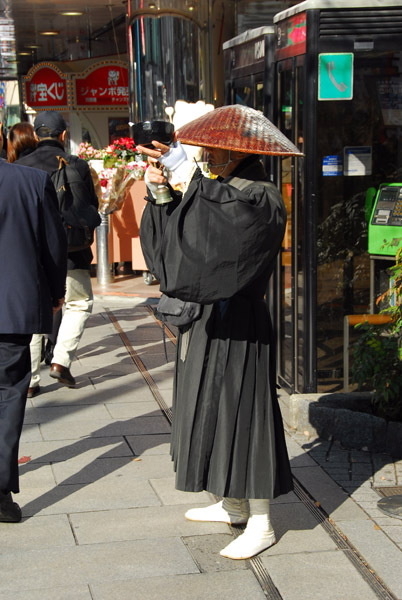 Japanese Buddhist monk with an alms bowl, Ginza