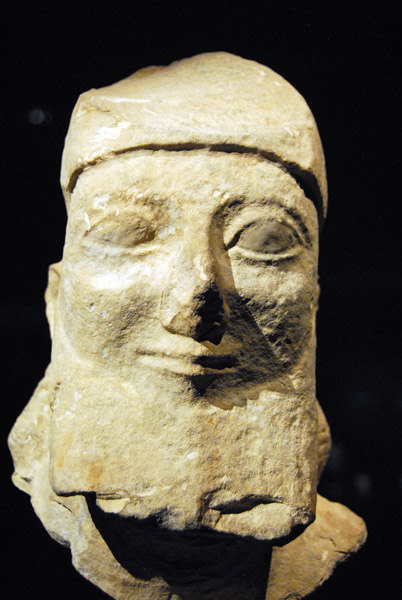 Bearded head of a votiv statue, Cyprus, 6th C. BC