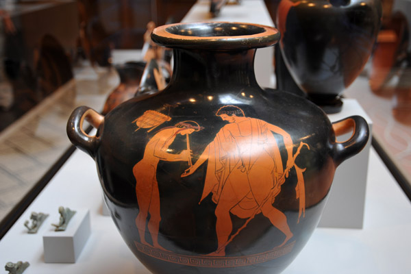 Kalpis (water jar) with a Reveler approaching a boy playing pipes reading Eucharides is beautiful, Athens ca 480 BC