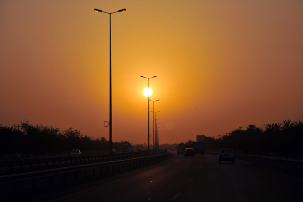 Oman coastal highway at sunset near Sohar