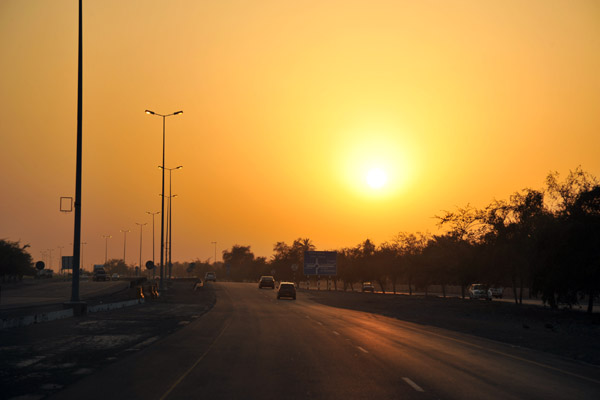 Oman coastal highway at sunset near Sohar