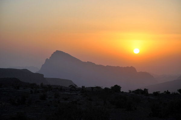Sun setting behind Jabal Misht