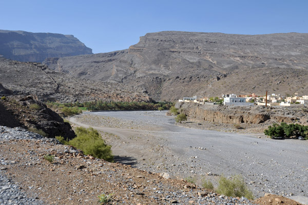 Wadi Ghul with the modern village of Ghul on the right and the summit of Jabal Shams on the left