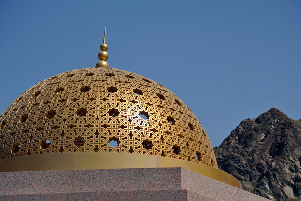 Gold-domed pavilions provide some shade along the Mutrah Corniche