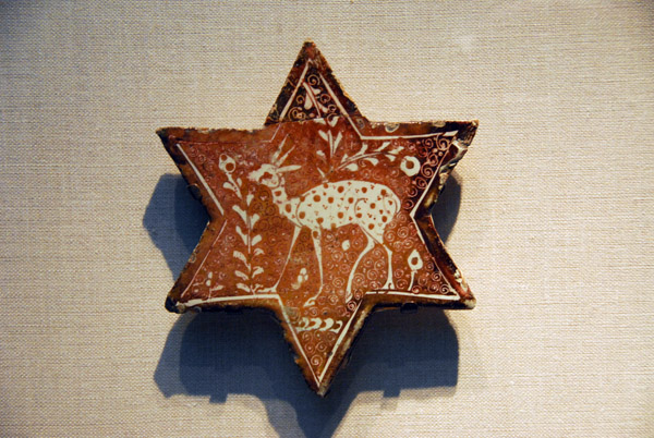 Early 13th C. Iranian tile in the form of a six-pointed star