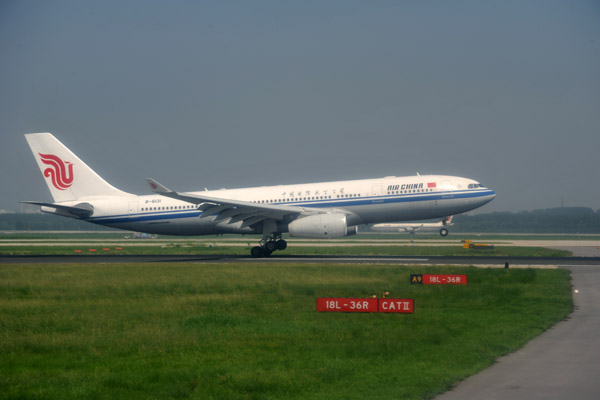 A great landing by an Air China A330 (B-6131) as we taxi for departure at PEK