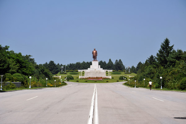 Kim Il Sung monument at the top of the grand boulevard of Kaesong