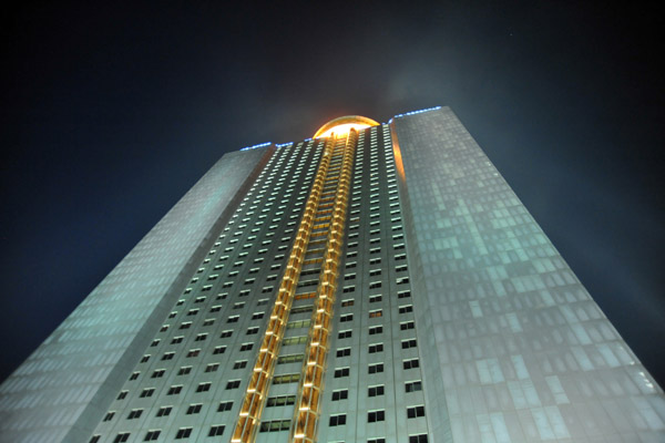 Yanggakdo International Hotel illuminated at night, Pyongyang