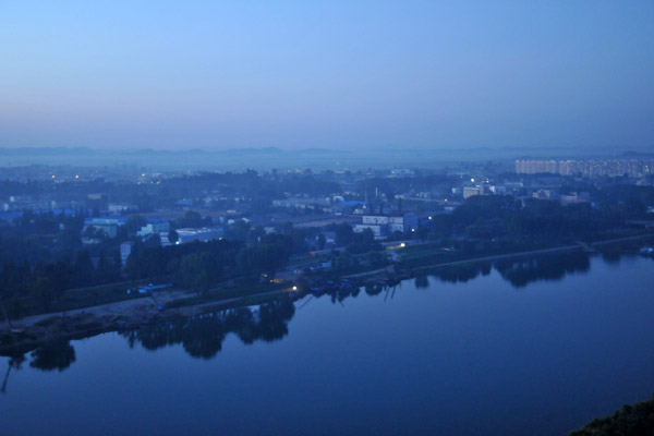 Still waters of the Taedong River at dawn