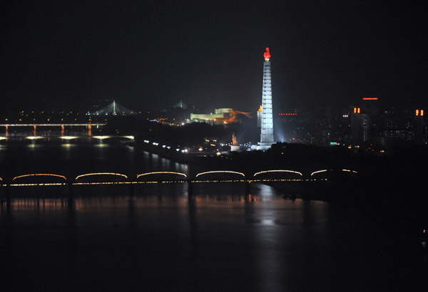 Juche Tower illuminated at night, from Yanggakdo Hotel