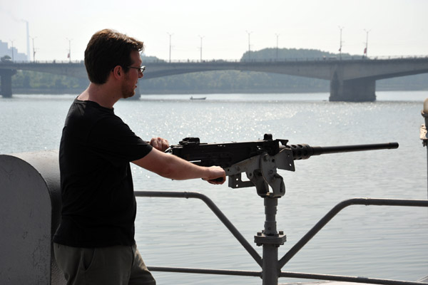James taking aim at a DPRK sailor on shore