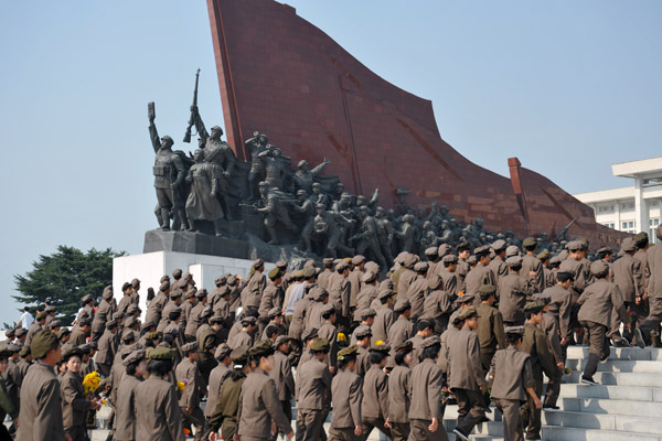 North Korean work unit in Mao suits at the Mansu Hill Grand Monument