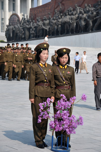 Two North Korean women in uniform at Mansu Hill