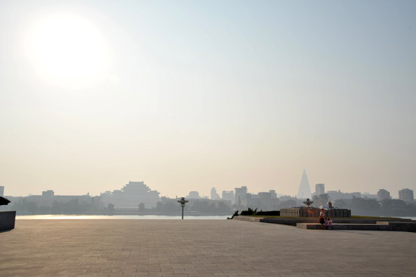 Looking across the plaza around Juche Tower to Kim Il Sung Square