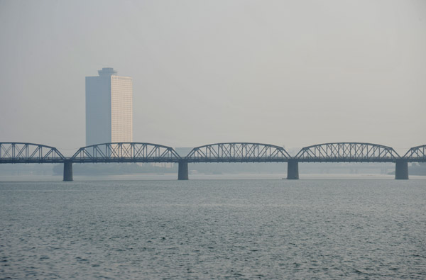 The Yanggakdo Hotel in the distance with the Taedong Bridge