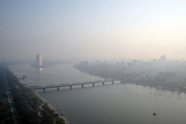 View south along the Taedong River to the Yanggakdo Hotel, Pyongyang