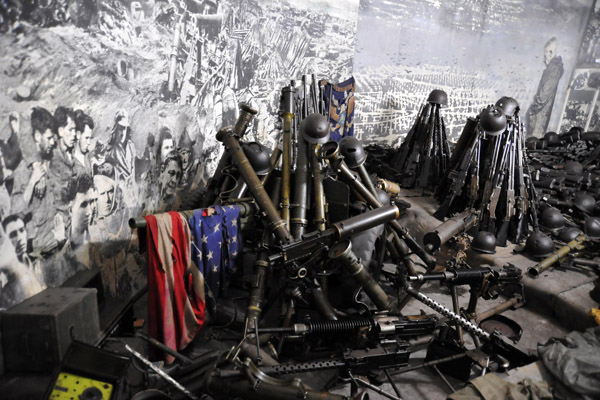 Captured American military gear and a tattered US flag, Victorious Fatherland Liberation War Museum